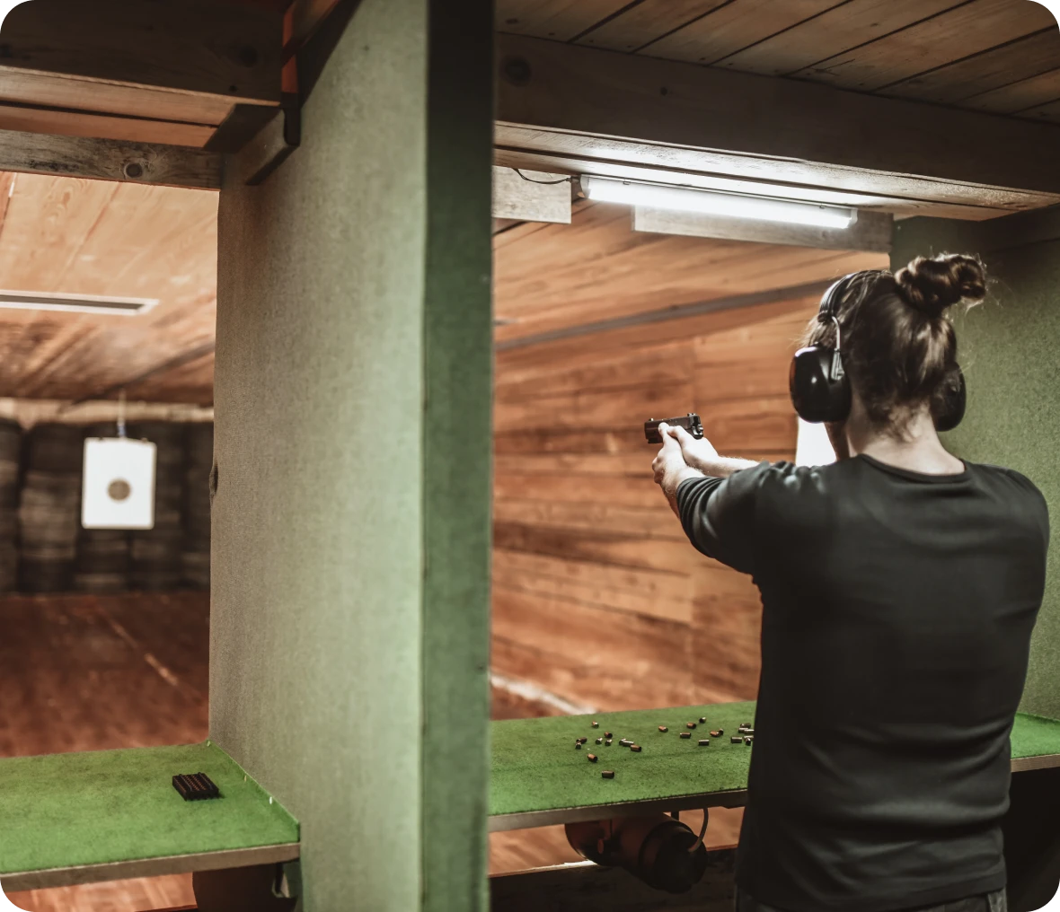 Individual practicing shooting with handgun